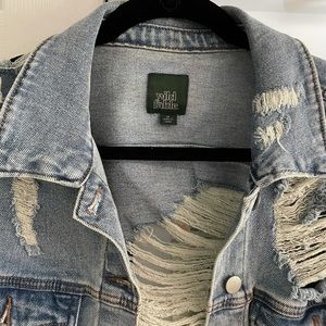 Distressed denim jacket